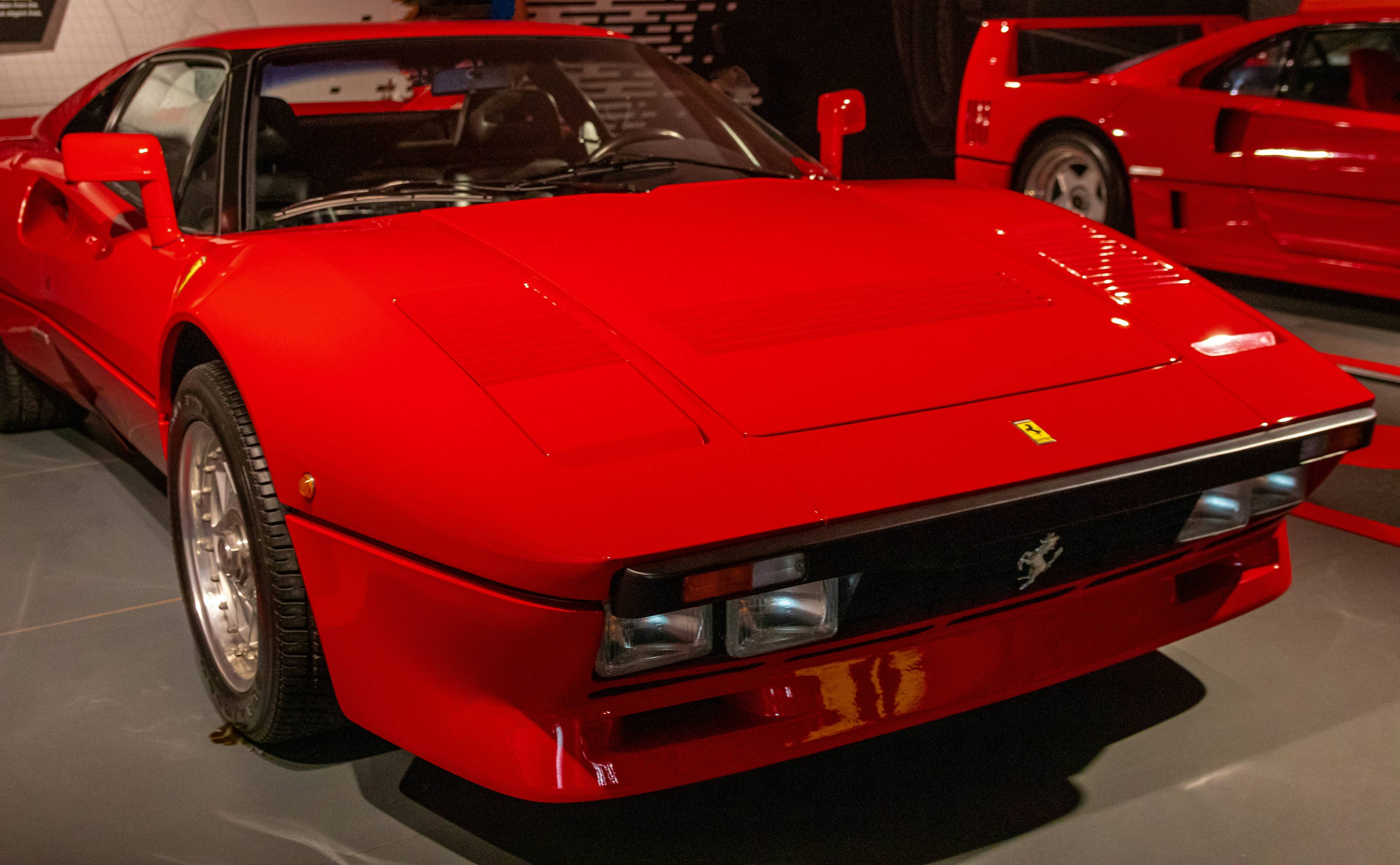 a red sports car parked in a garage